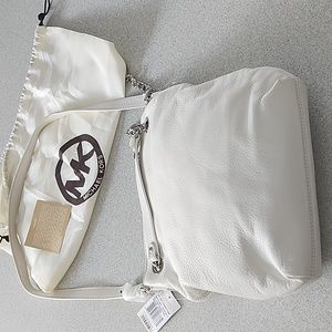 Brand new white leather MK purse. Some creasing in leather from storage. Roomy